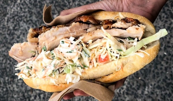 rotisserie pork and slaw on a roll